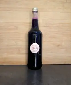 Fles blauwe bes siroop